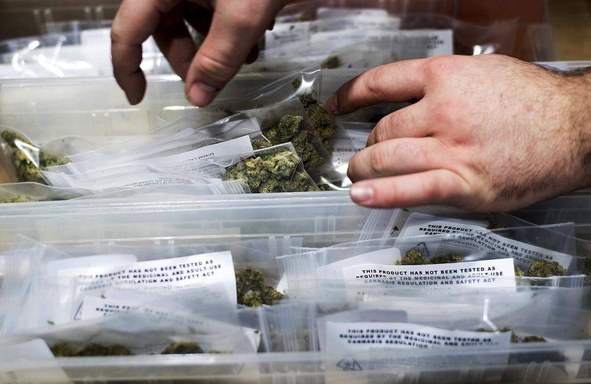In this Jan. 6, 2018, file photo, an employee stocks cannabis at a store shortly before its first day of recreational marijuana sales in San Francisco. In Fresno, voters overwhelmingly approved a marijuana business license tax in November, and the Fresno City Council in December passed regulations for businesses. But another issue still isn’t settled: social equity in cannabis.