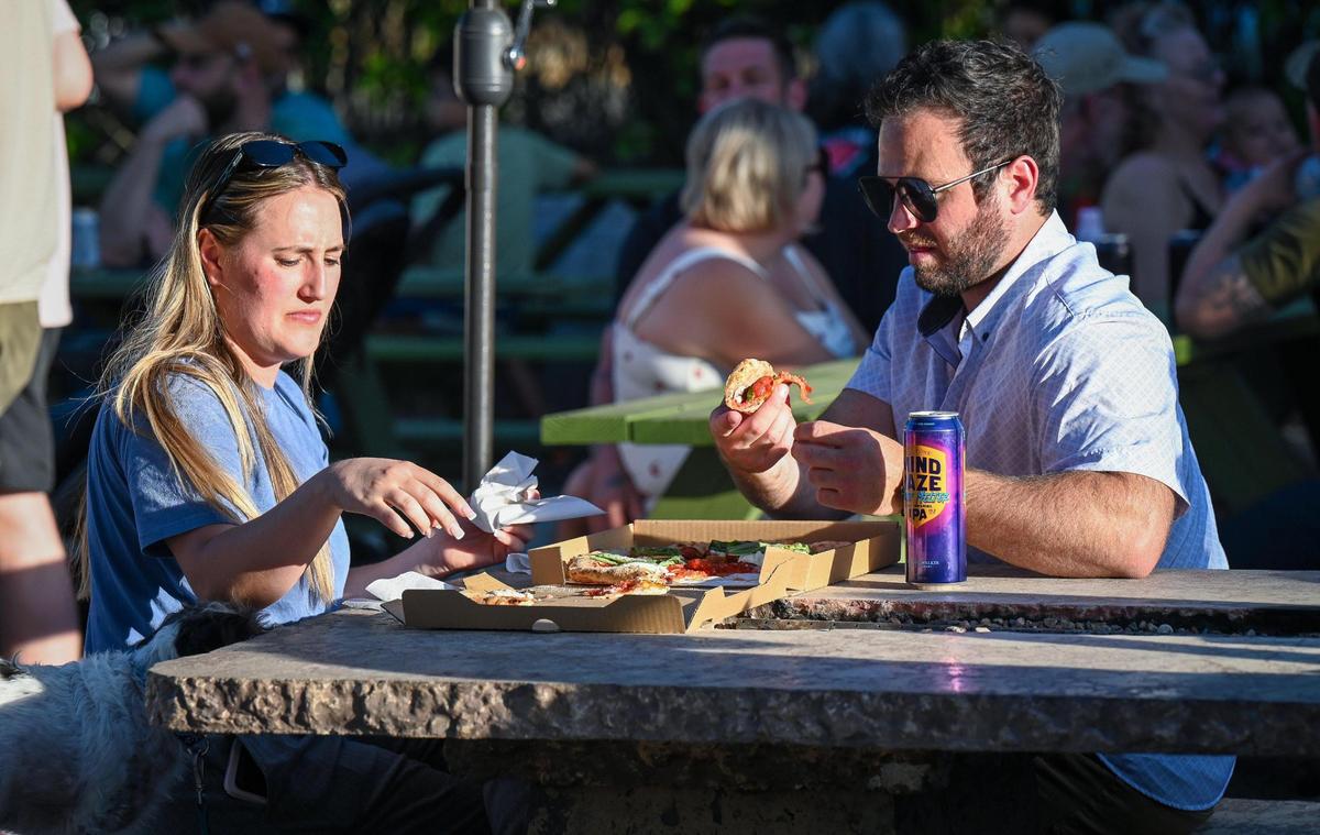 Patrons enjoy food, beer and music during Gazebo Gardens nursery’s beer garden event on Thursday, May 15, 2025.