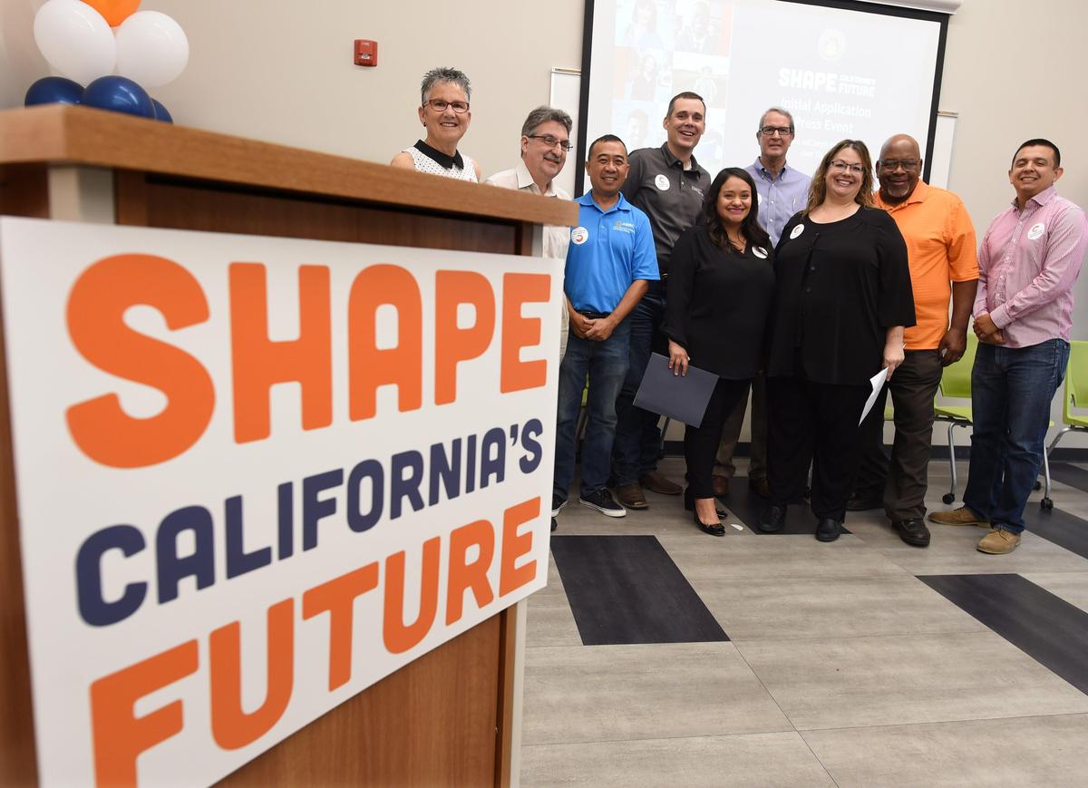 Hanford native Stephanie Ramirez-Ridgeway, chief council for the California State Auditor’s office, center right, poses with local dignitaries after her news conference to announce the application period for state residents to have a chance to serve on the 2020 Citizens Redistricting Commission at the Betty Rodriguez Regional Library in Fresno, California on Tuesday, June 11, 2019.