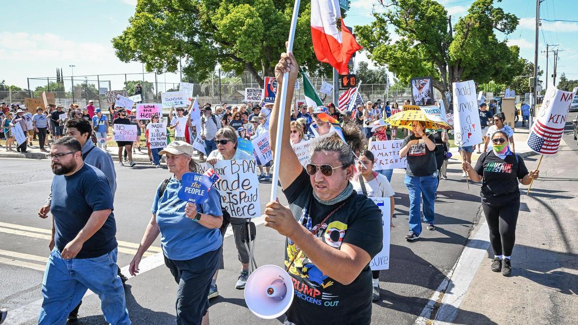 Protesters march toward Shaw Avenue in front of Fashion Fair Mall for a “No Kings” protest against President Donald Trump’s policies on Saturday, June 14, 2025.