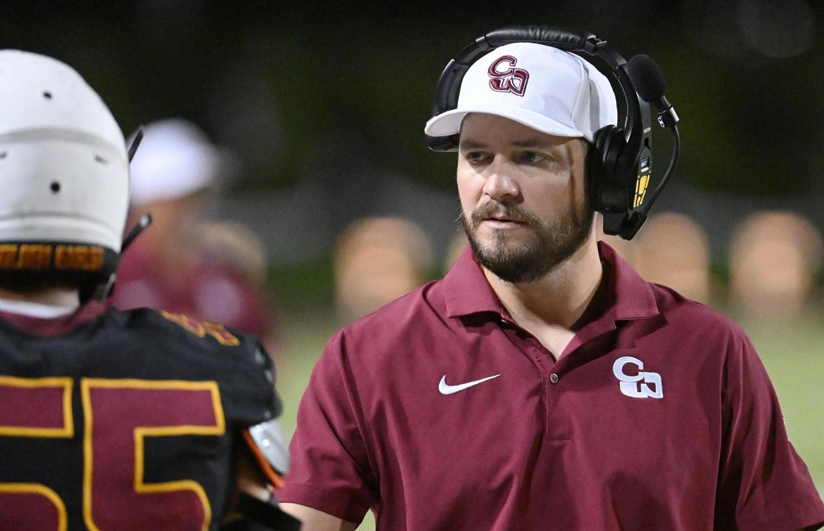 Clovis West head coach Eric Brown walks the sideline during their game against Lemoore at Veterans Memorial Stadium on Friday, Sept. 1, 2023.