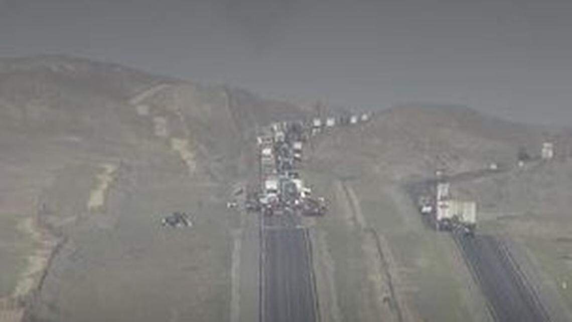 A Caltrans camera screengrab of Interstate 5 near Derrick Avenue where a crash that killed four has shutdown the southbound side, California Highway Patrol said Wednesday, March 2, 2022.