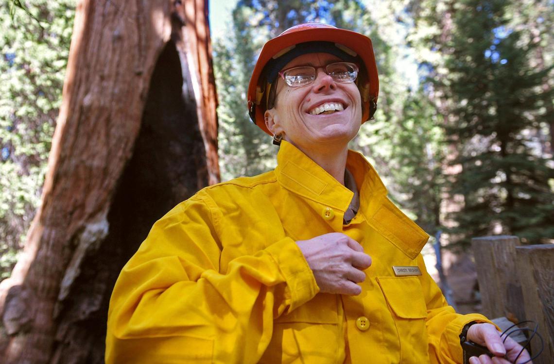 Christy Brigham, Chief of Resource Management and Science for Sequoia and Kings Canyon National Parks, stands in front of the General Grant giant sequoia during a tour of the KNP Complex Fire Wednesday, Oct. 13, 2021 in Grant Grove, Kings Canyon National Park.