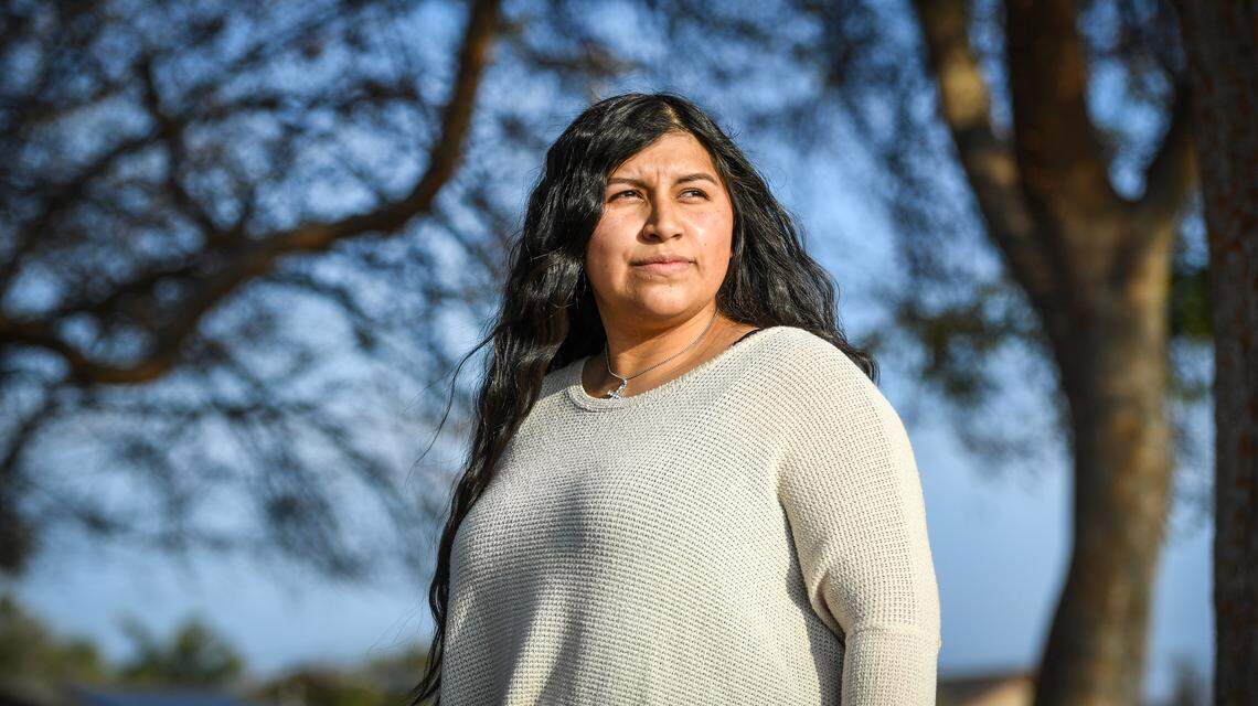 Jessica Ramirez stands in a Fresno park near her current home on Friday, Jan. 8, 2021. The mother of six has been dealing with housing insecurity.