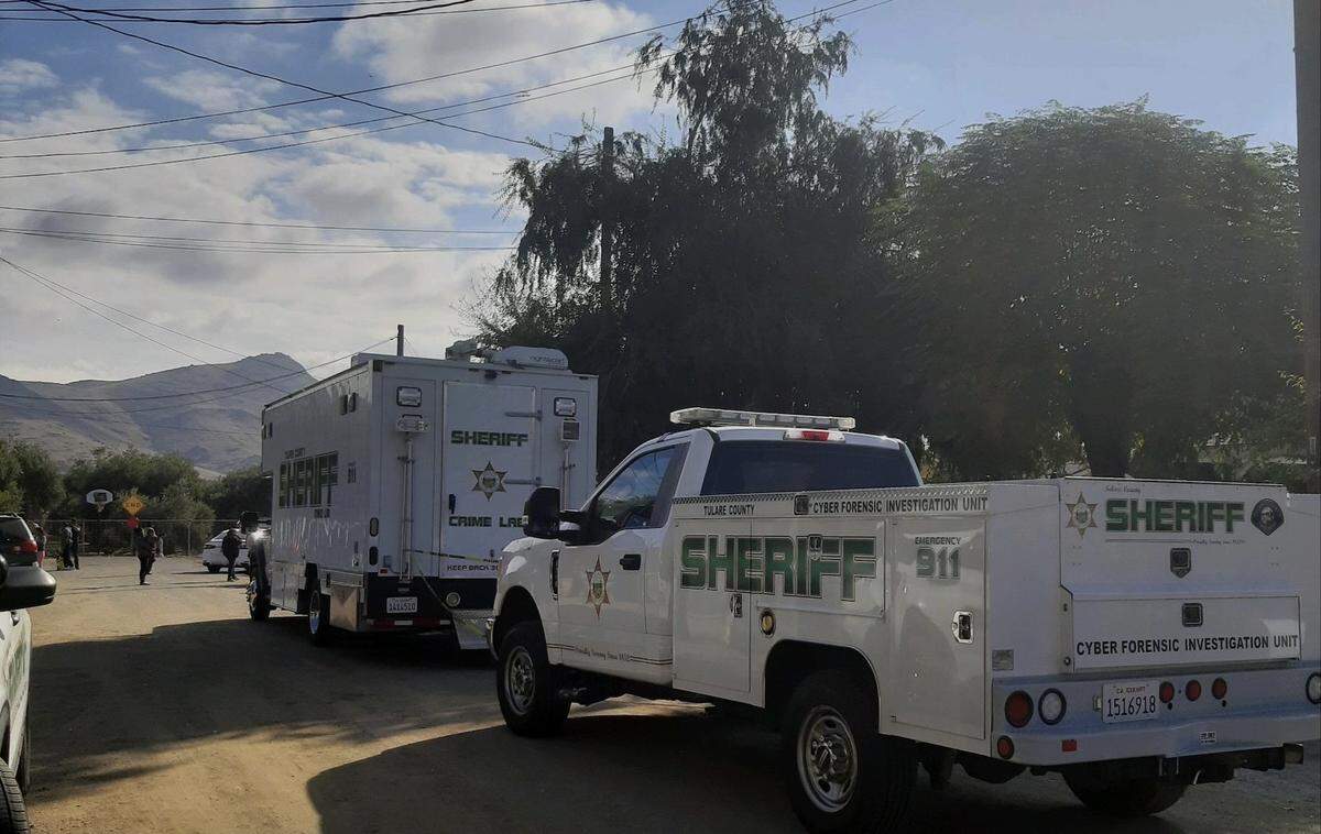 Tulare County Sheriff’s Office deputies investigate a stabbing Saturday, Oct. 23, 2021, at a home in the 21000 block of Brooks Avenue in Tonyville, near Lindsay, California.