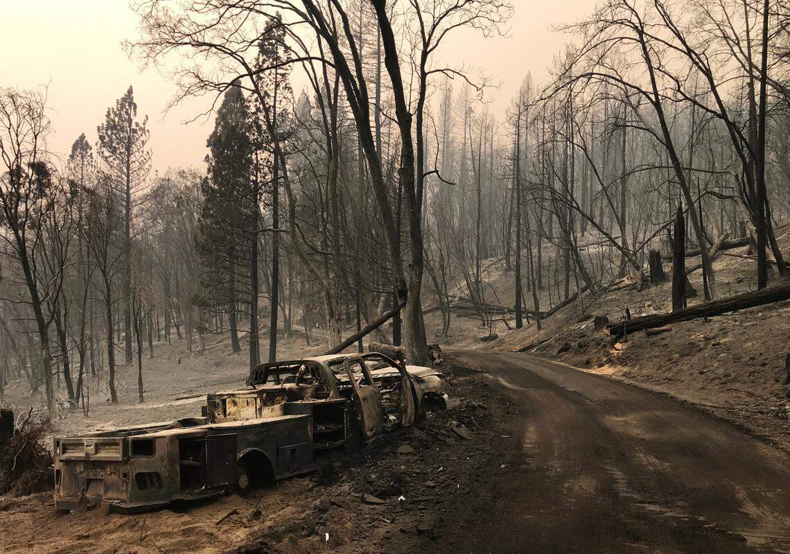 A truck and landscape burned by the Creek Fire seen along Peterson Road south of Pineridge Friday, Sept. 11, 2020. This site is southeast from the top of the Highway 168 four-lane.