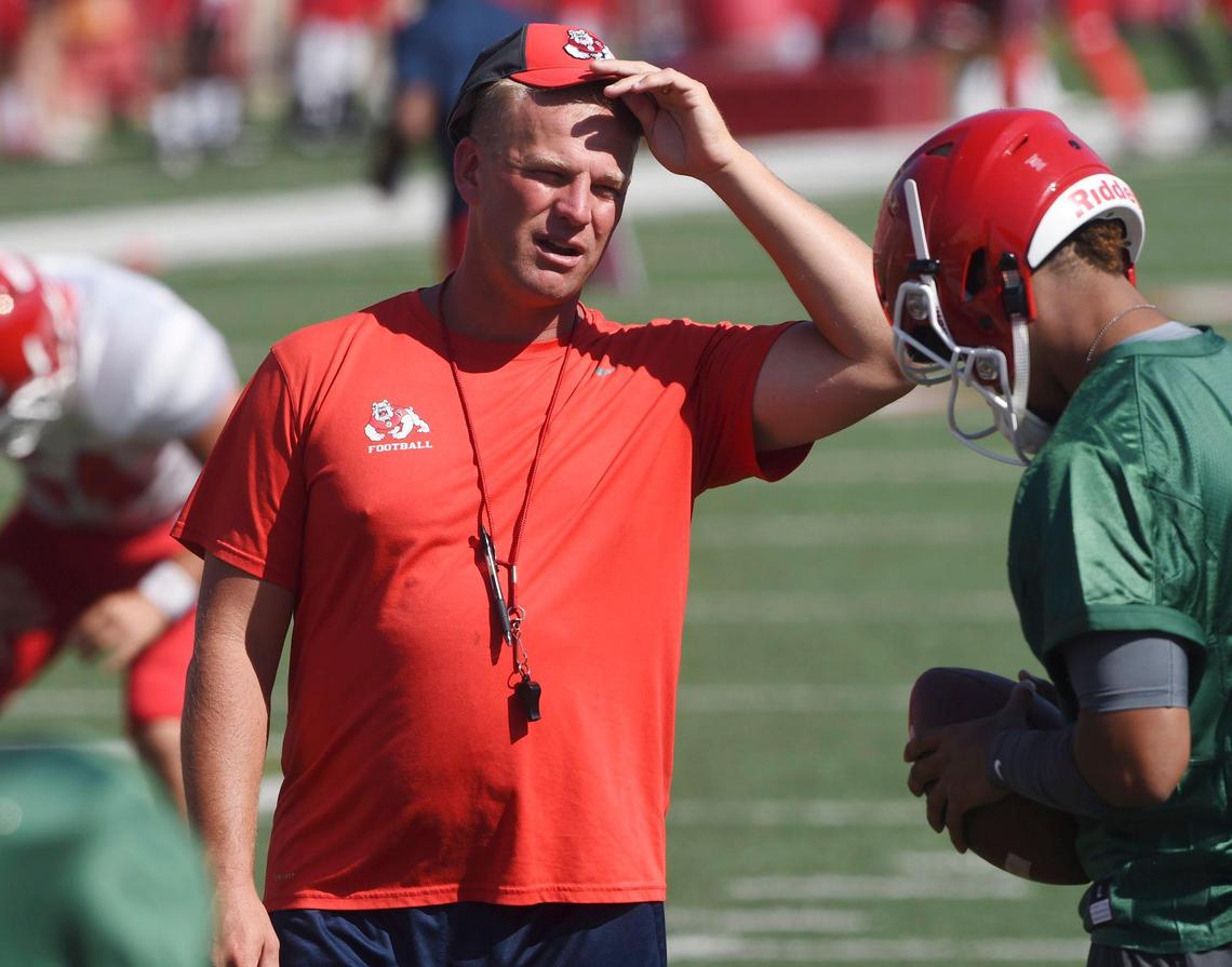 Former Fresno State offensive coordinator Kalen DeBoer, left, has been hired to replace coach Jeff Tedford, who stepped down Dec. 6 due to health issues.. DeBoer left Fresno State after the 2018 season to be offensive coordinator at Indiana.