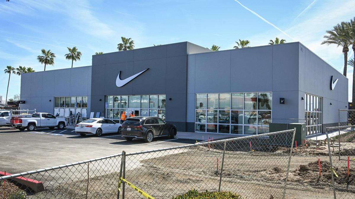Workers put finishing touches on details at the new Nike Unit store at the corner of Blackstone and El Paso avenues in River Park. The store opens this week.