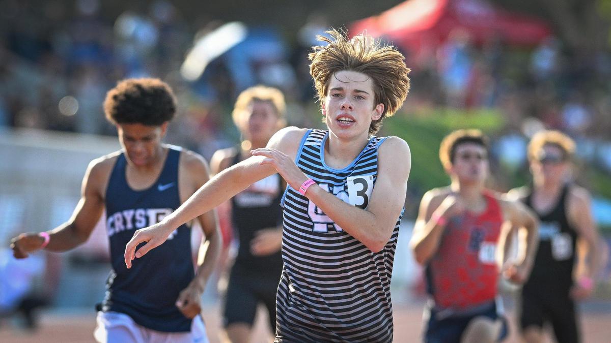 Conor Lott of Clovis North crosses the finish line in first during the CIF state track & field boys 1600 meter final at Buchanan’s Veterans Memorial Stadium on Saturday, May 31, 2025.