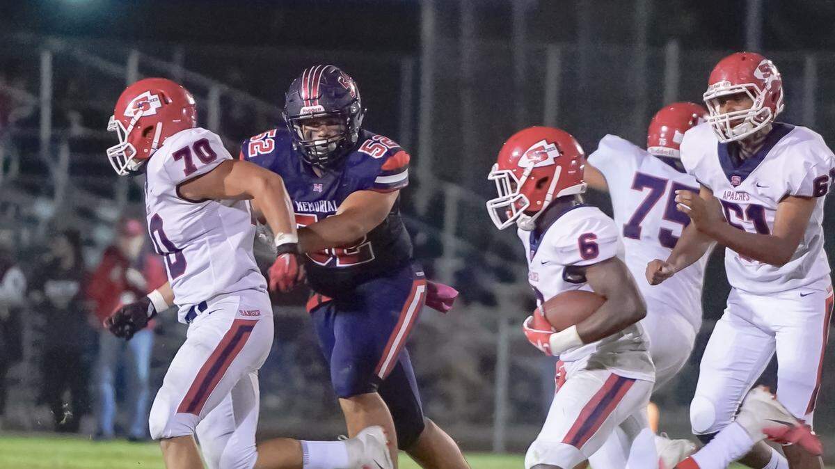 San Joaquin Memorial defensive tackle Tobin Phillips, middle, verbally committed to Stanford.