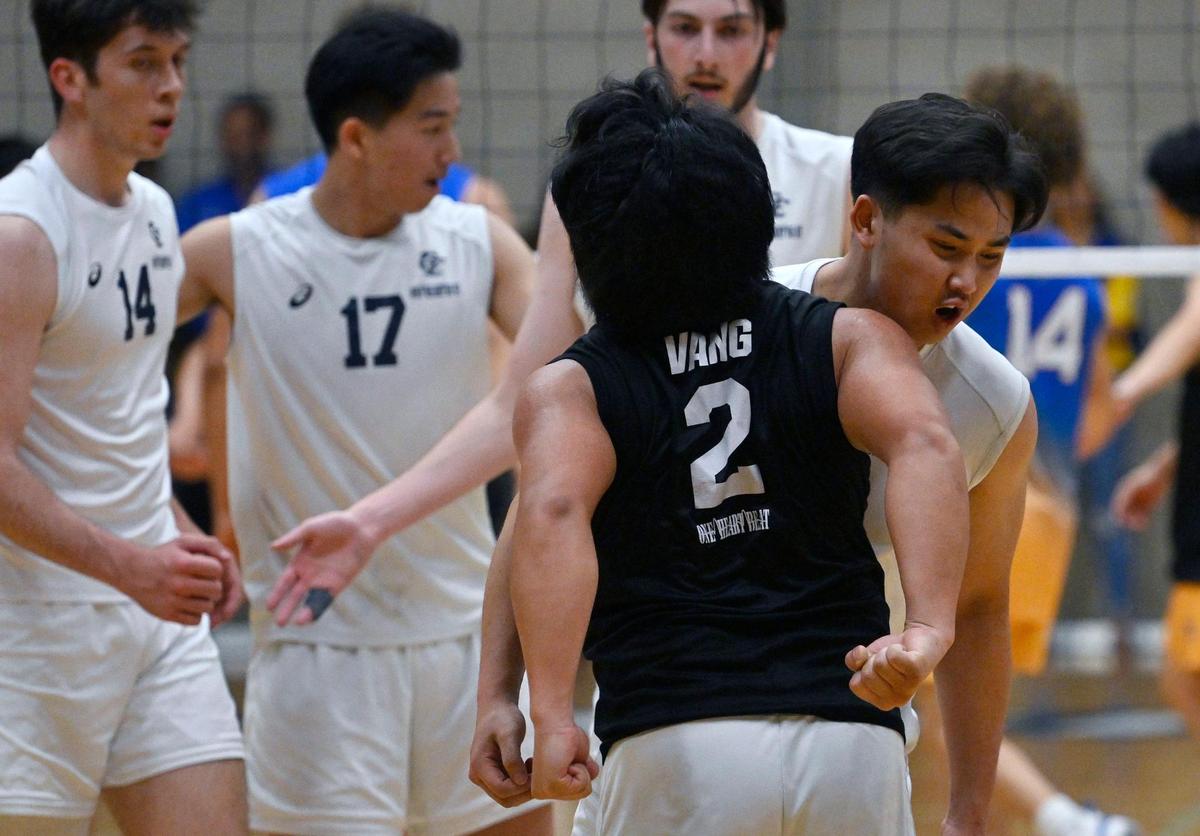 Clovis East’s Jacob Vang, foreground, and Landon Moua, background, chest-bump after a point against Clovis High in the Central Section Division I Volleyball Championship Thursday, May 11, 2023 in Clovis.