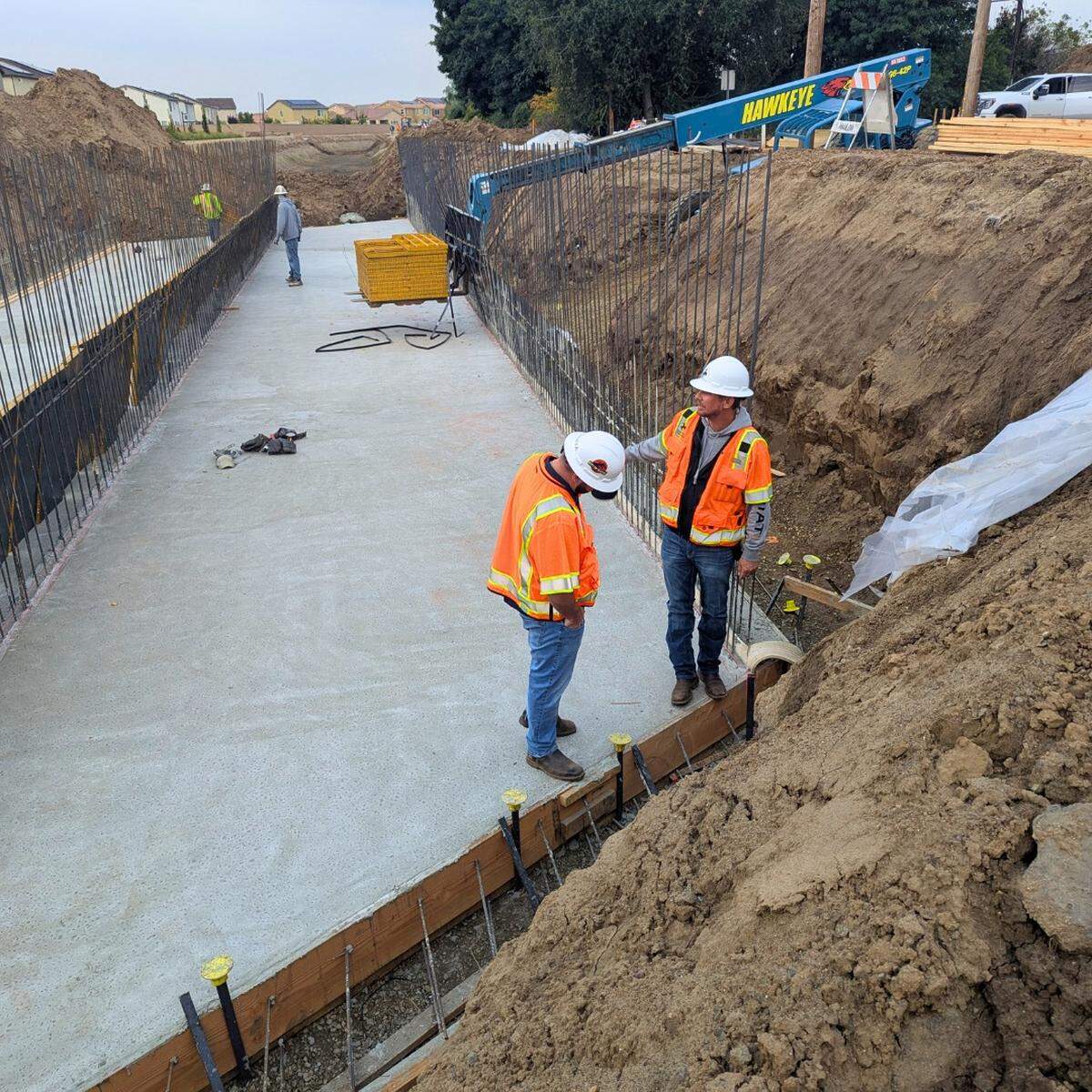 Crews in Clovis are nearly finished replacing the 100-year Leonard Avenue timber bridge near Bullard Avenue. New box culverts will improve the canal and allow future widening.