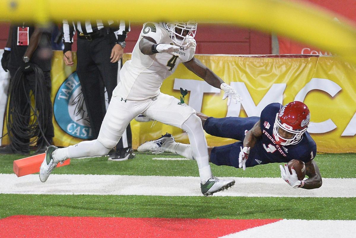 Fresno State wideout Keric Wheatfall, right, comes down with the football in the end zone in front of Colorado State’s Rashad Ajayi but had stepped out of bounds before the catch during their game at Bulldog Stadium on Thursday, Oct. 29, 2020.
