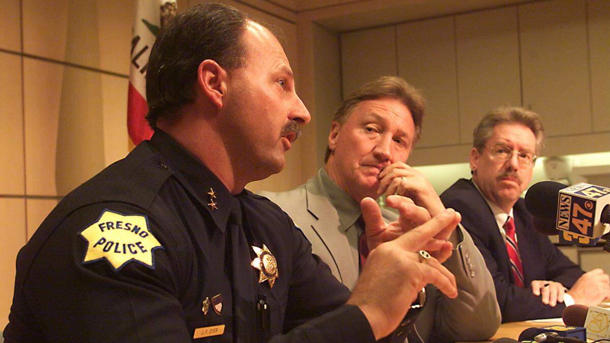 Newly named as the next Fresno police chief Jerry Dyer, left, speaks about his past and selection to the position at a news conference Monday July 23, 2001 as Fresno Mayor Alan Autry, center, and City Mmanager Dan Hobbs, left, look on.