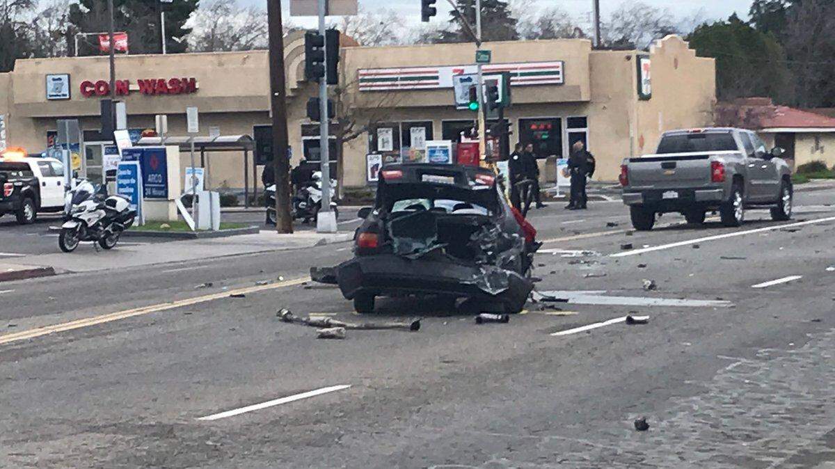A Honda sedan was involved in a collision during a police pursuit in Fresno, California on Wednesday, March 6, 2019, disrupting the morning commute as the intersection of Fruit and Clinton avenues was shut down for the investigation.