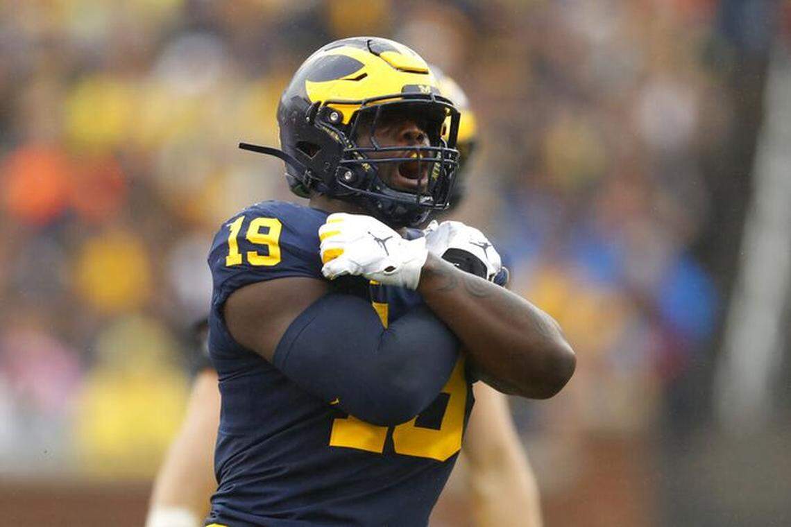 Former Michigan defensive end Kwity Paye reacts after sacking Rutgers quarterback Artur Sitkowski in the first half of an NCAA college football game in Ann Arbor, Mich., Saturday, Sept. 28, 2019.