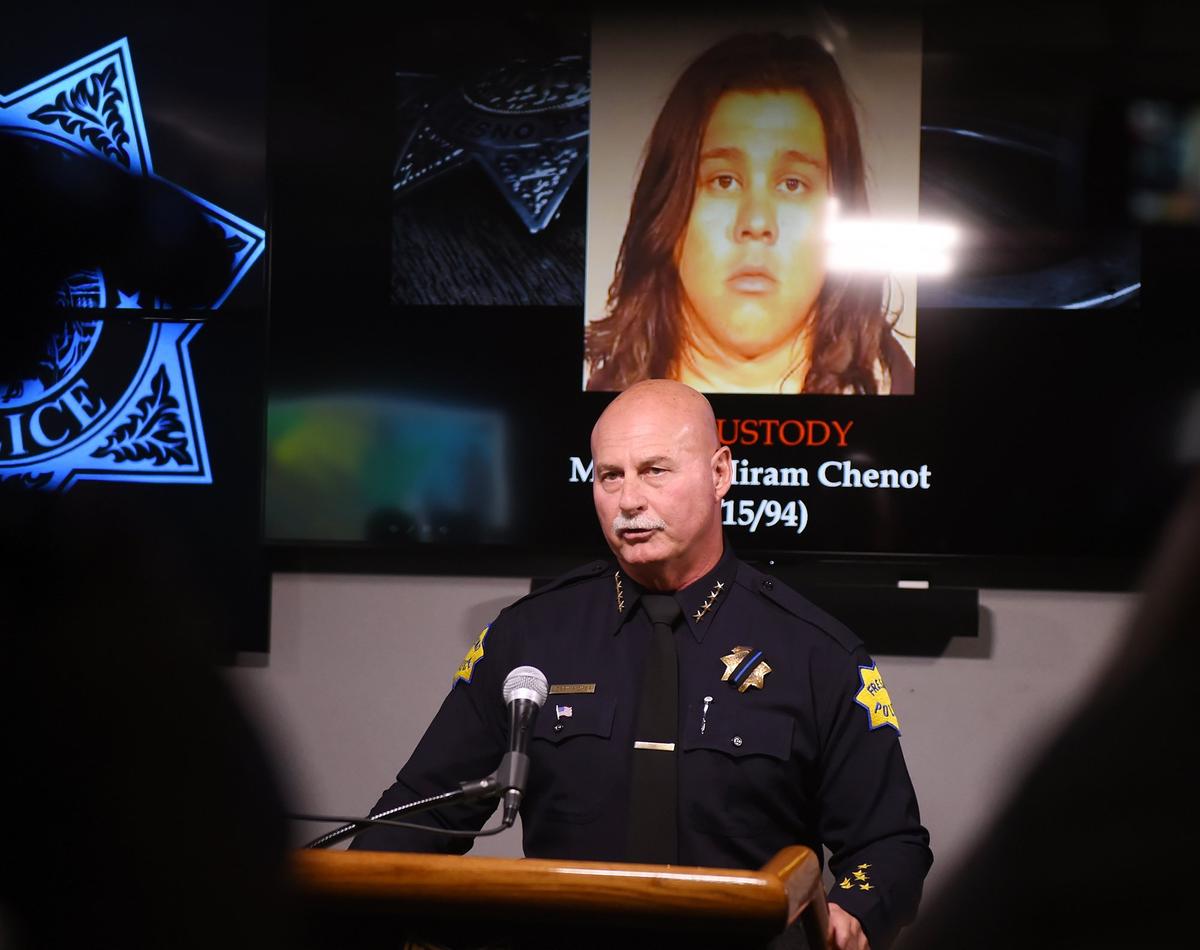 Fresno Police Chief Jerry Dyer updates the media on a fatal hit and run that took place on Friant Road at Copper River Drive Feb. 22, 2019 in Fresno. The suspect shown in the background is Matthew Hiram Chenot.