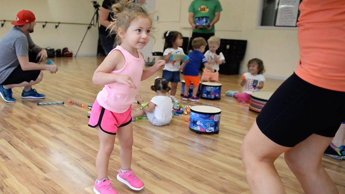 Emma Patrick, 2-1/2, of Fresno dances with her mother Stephanie during Amanda Sciacca’s Zumbini class in Fresno in 2017.