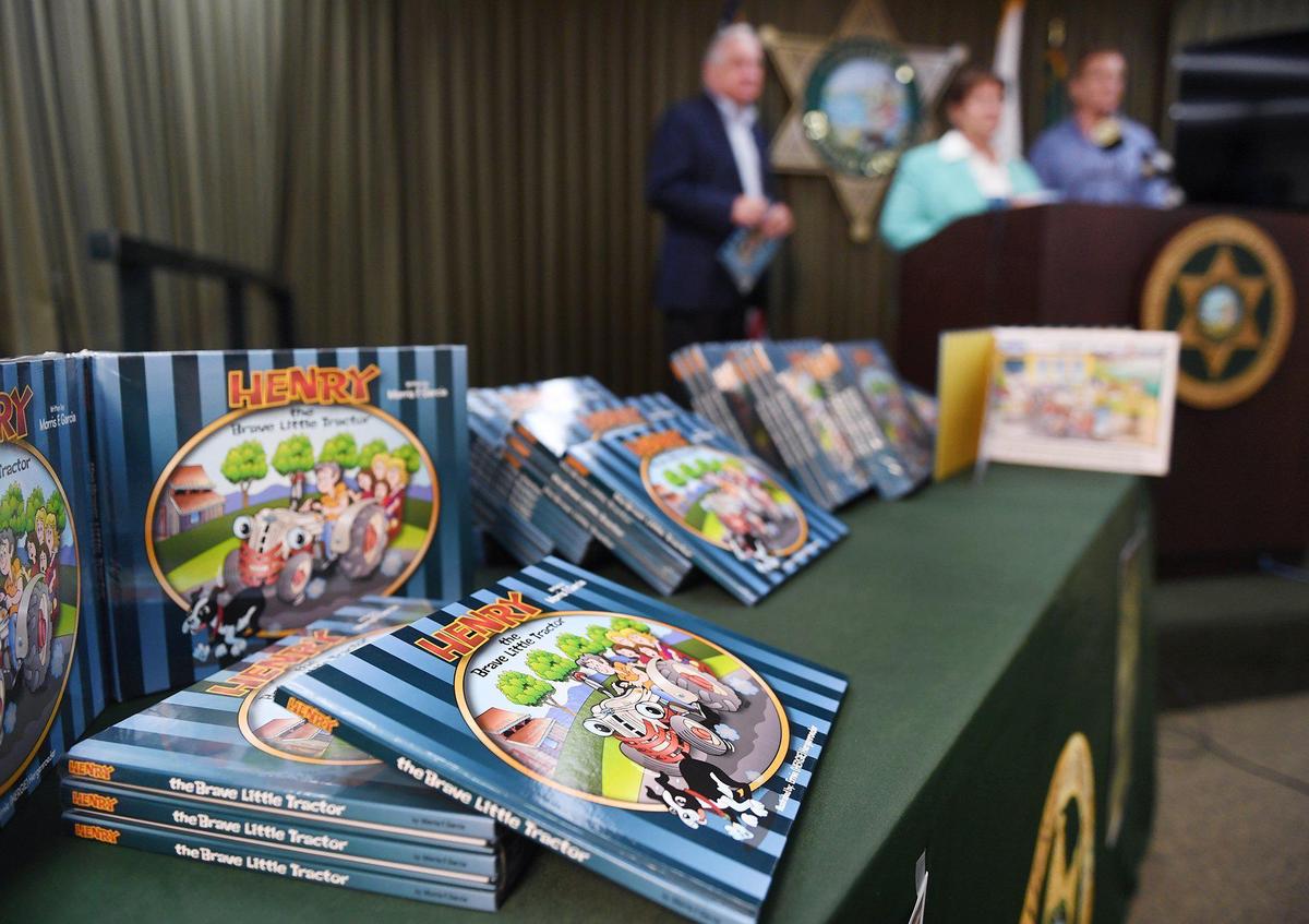 One hundred copies of the late author Morris Garcia’s children’s book “Henry the Brave Little Tractor” were donated Monday, Aug. 9, 2021, to the Fresno County Sheriff’s Reading Posse program that helps encourage youth literacy.