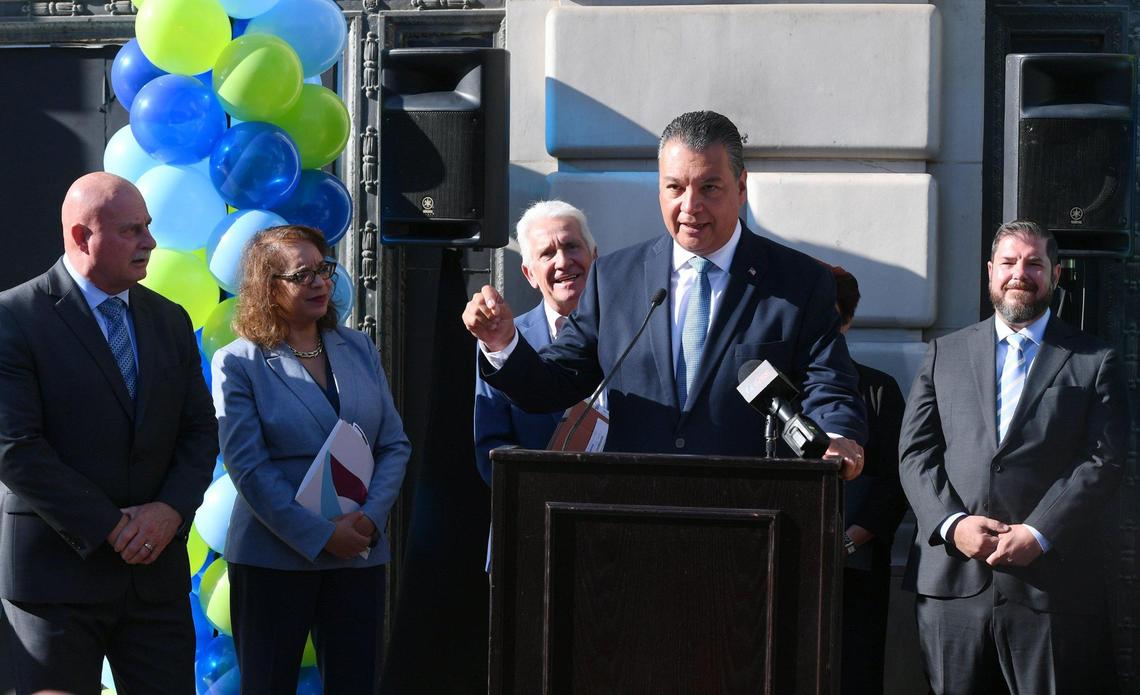 U.S. Senator Alex Padilla, center at lectern, leads a press conference announcing two Federal grants totaling $88.1 million with left to right in the background, Fresno mayor Jerry Dyer, U.S. Assistant Secretary of Commerce Alejandra Castillo, Rep. Jim Costa, D-Fresno, and Assemblyman Joaquin Arambula, D-Fresno, far right, Friday morning, Oct. 14, 2022 in downtown Fresno.