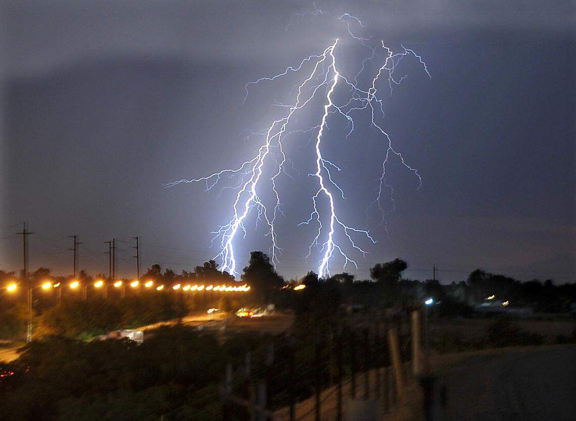 Lightning along Shepherd Avenue, looking west at Clovis, on Aug. 19, 2013.