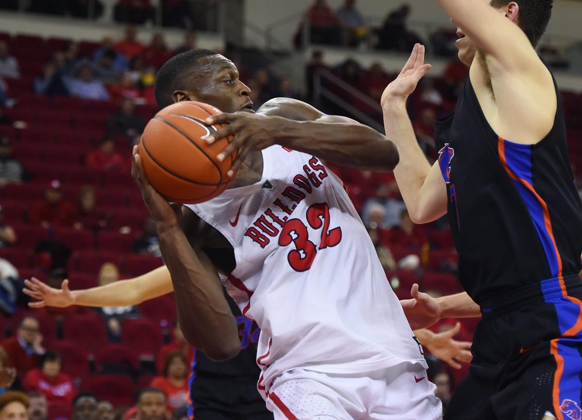 Fresno State’ forward Nate Grimes, left, runs up against Boise State’s Justinian Jessup, right, in the second half of the Bulldogs’ 65-63 victory over the Broncos Wednesday, Feb. 13, 2019 in Fresno. Grimes had his ninth double-double of the season with 13 points and 15 rebounds.