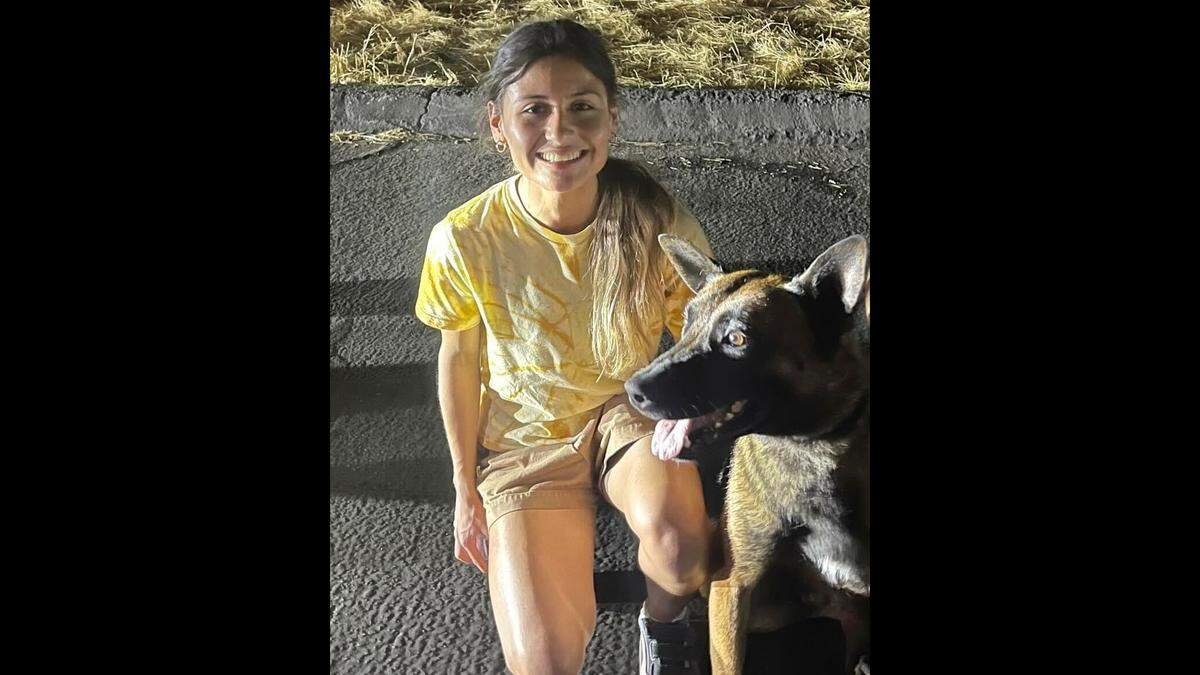 Camryn Escoto poses in Fresno with Odin, a Madera County Sheriff’s Office K-9 who went missing on Sunday, July 2, 2023.