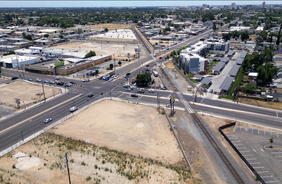 Cleared land is seen at the intersection of Blackstone and McKinley avenues, photographed Monday, June 8, 2026 in Fresno. The Taco Bell was located on the left side of the intersection before it was torn down. The city has purchased most of the land around the intersection so it can lower the street as much as 25 feet to avoid traffic backups when trains cross.