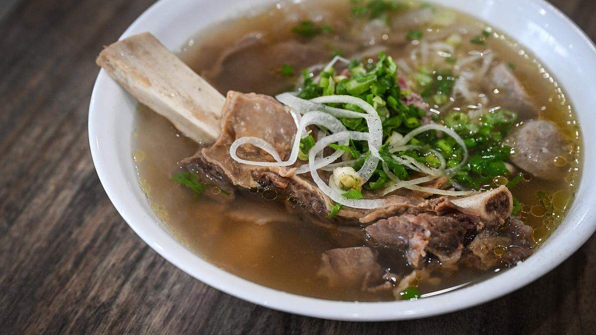 A bowl of Nho's beefy pho featuring beef back rib, tendon, meatball, brisket, tripe, and rare steak from Nho Kitchen in the Mayfair Center at First and McKinley in Fresno on Tuesday, Dec. 2, 2025.