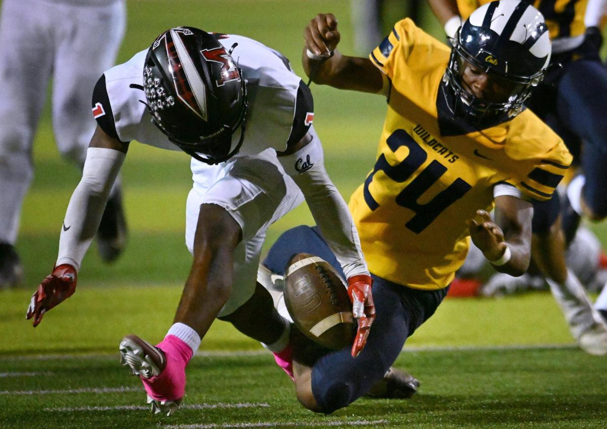 McLane’s Da’zir Newhouse, left, tries to recover a fumble Friday, Oct. 20, 2023 in Fresno.