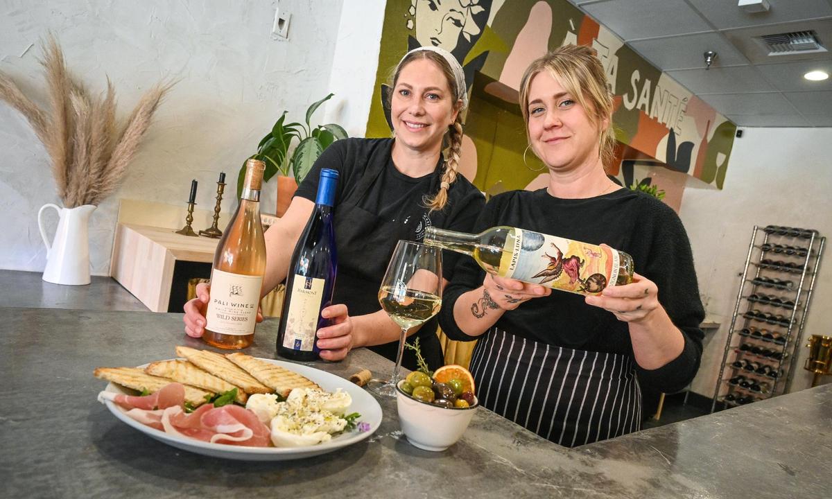 Allison Cassabon, left, and Kellie Lopez are longtime friends who decided to open a wine bar and eatery called Lune, the French word for moon, on Fulton Street near Chukchansi Park in downtown Fresno.