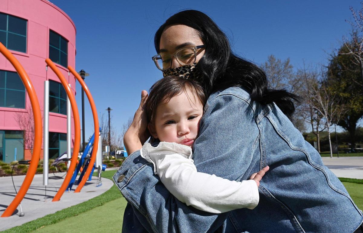 Willow Vander Laan, 1, hugs her mom Angelica Hernandez at Valley Children’s Hospital Friday, Feb. 25, 2022 near Madera. Willow was diagnosed with Spinal Muscular Atrophy.