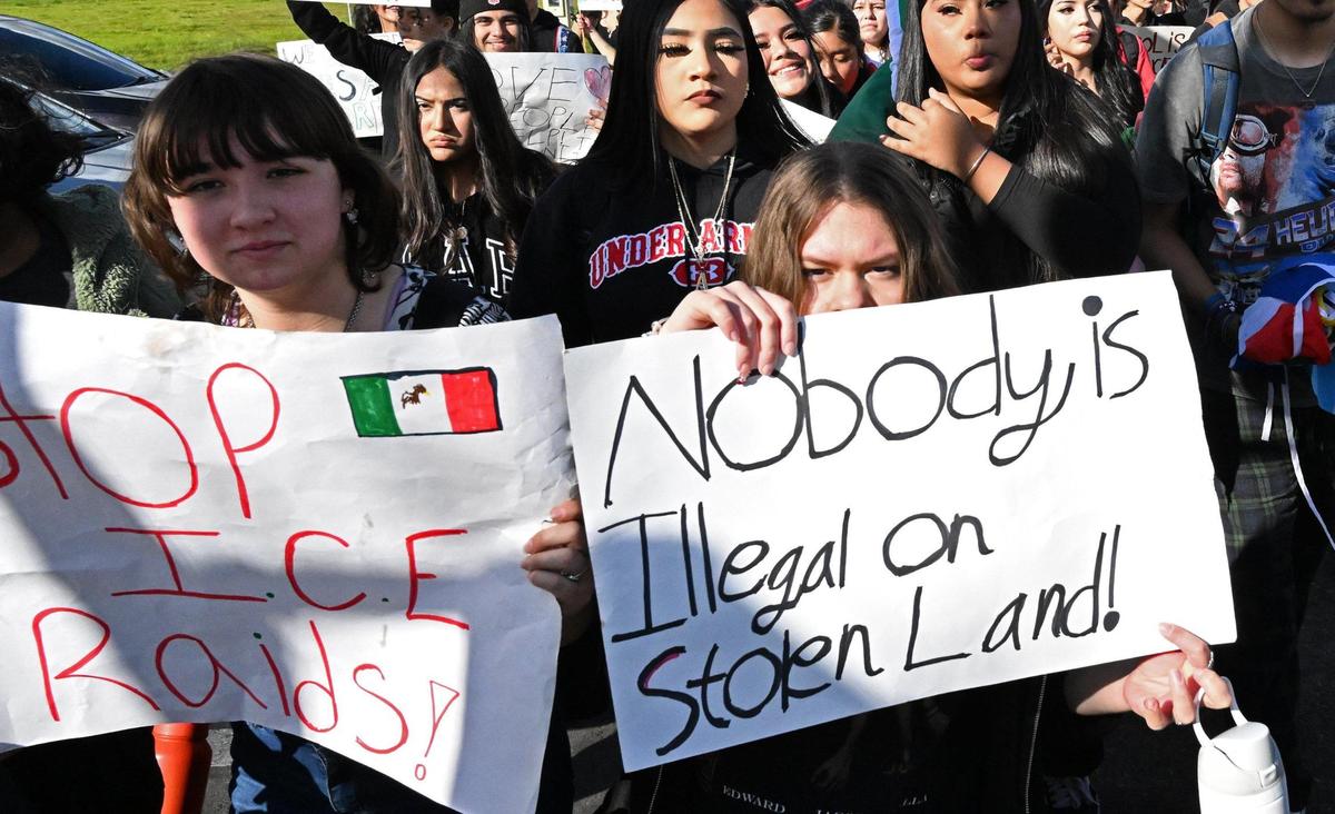 Students from McLane High School march along Cedar Avenue protesting anti-immigration sentiment in the Federal government Friday, Feb. 7, 2025 in Fresno.