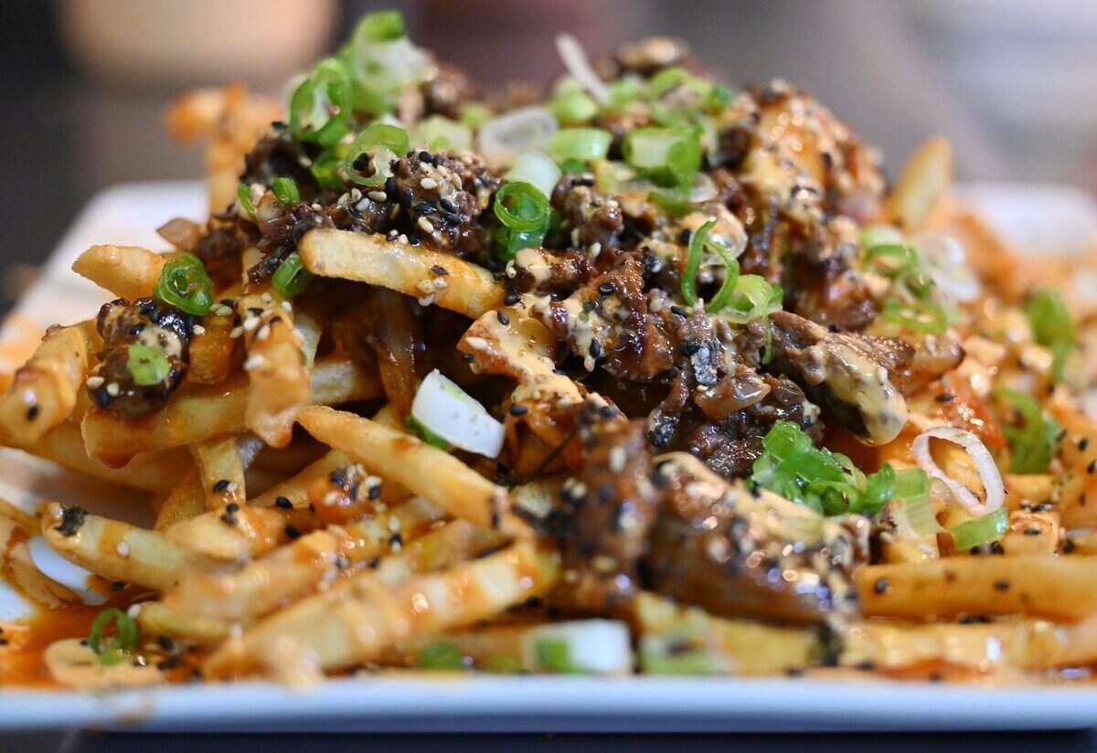 Kimchi Fries, reknown fries from Little Leaf Bar & Restaurant, photographed Wednesday, July 15, 2026 in Fresno.