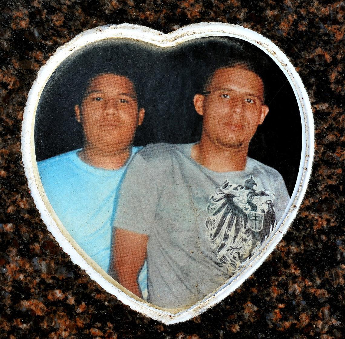 The Leon Brothers, Daniel, left, and Rene, right, in a photo on their headstone, were reportedly victims of the MS-13 gang, killed Sept. 11, 2011.