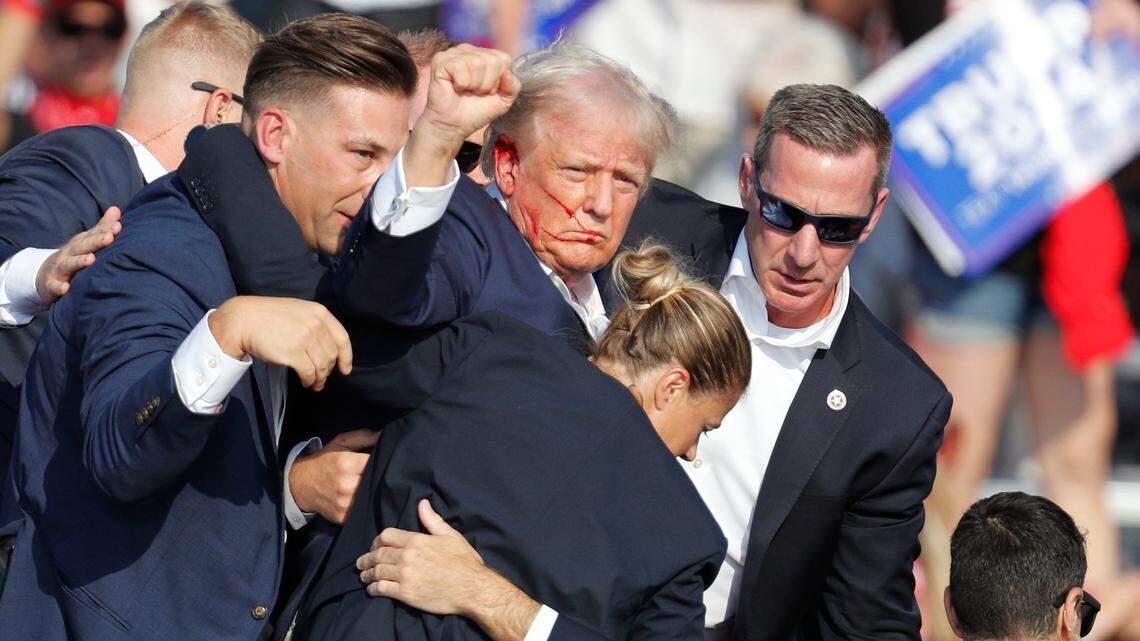 Former U.S. President Donald Trump is removed from the stage by the Secret Service following an incident during a campaign rally on July 13, at the Butler Farm Show Inc. in Butler, Pennsylvania. A corrido praising Trump in the wake of the attack has gone viral on social media.