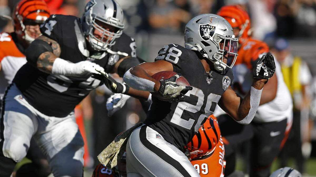 Las Vegas Raiders running back Josh Jacobs runs with the ball against the Cincinnati Bengals in 2019.