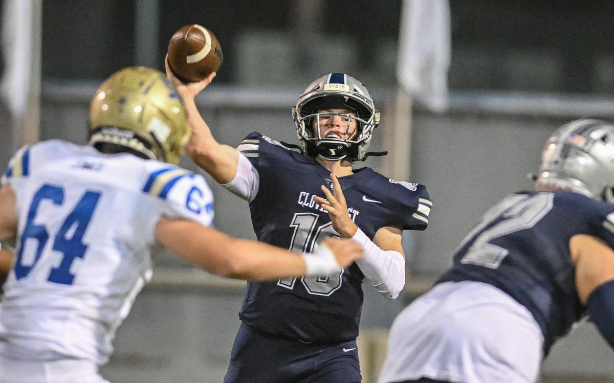 Clovis East quarterback Tyus Miller throws downfield against Clovis during their game at Lamonica Stadium on Friday, Oct. 20, 2023.