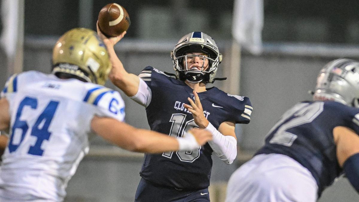Clovis East quarterback Tyus Miller throws downfield against Clovis during their game at Lamonica Stadium on Friday, Oct. 20, 2023.