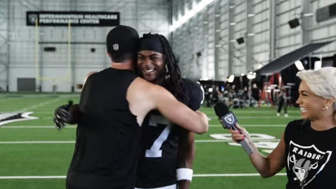 Las Vegas Raiders quarterback Derek Carr sees Davante Adams for the first in a Silver and Black uniform on Monday, June 6, 2022.