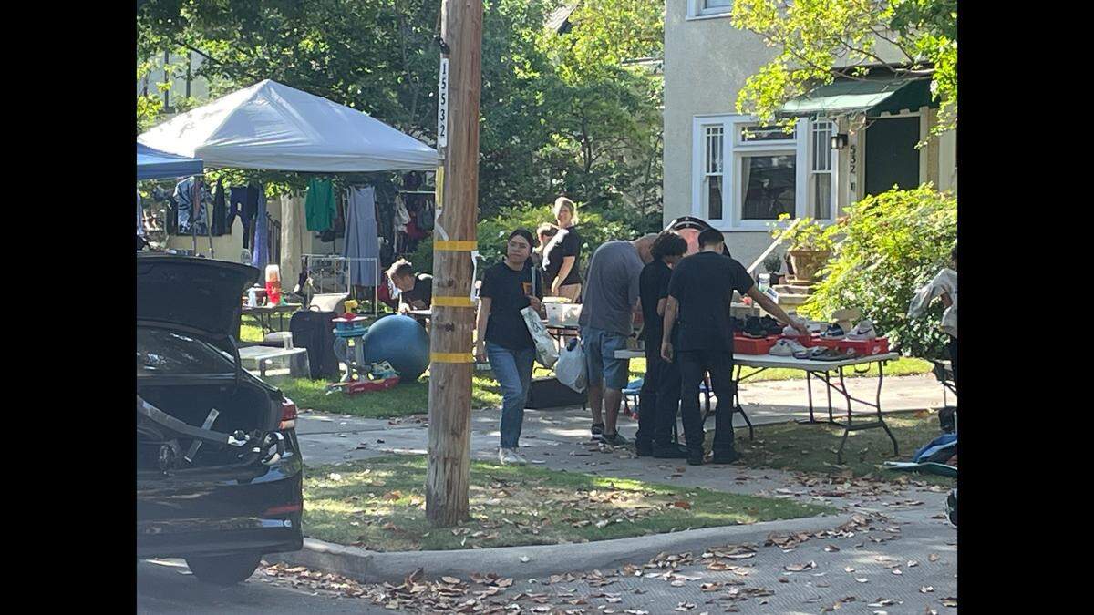 Shoppers check out items for sale along Terrace Avenue in the Fresno High neighborhood Saturday during an annual Spring yard sale.