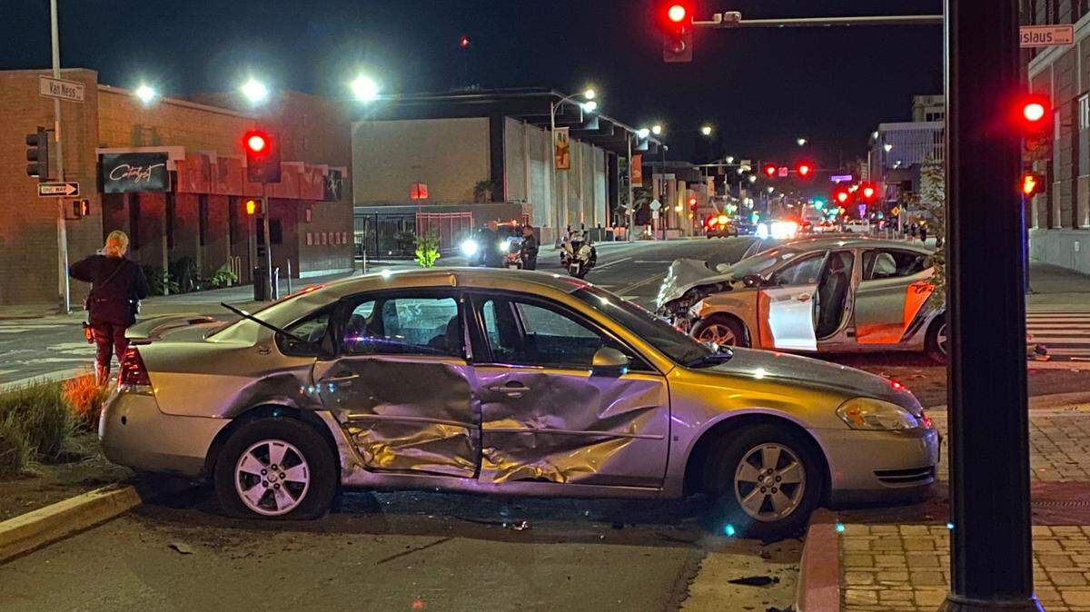 Police investigate a two-vehicle crash in which one of the vehicles was stolen before the collision in Fresno, California on Sunday, March 31, 2024.