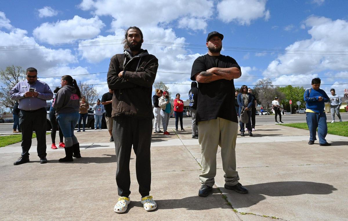 Concerned parents gather outside Herbert Hoover High School after a hoax call from outside the area forced a lockdown Friday around noon, March 24, 2023 in Fresno.