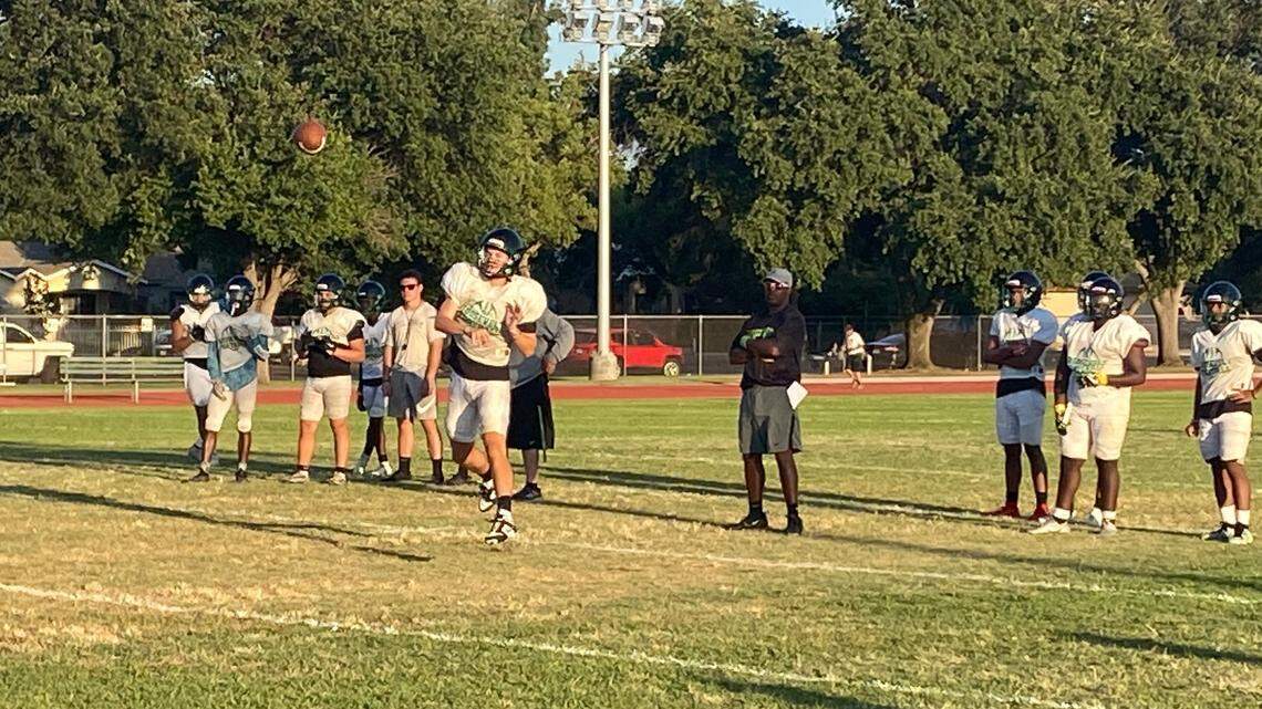 Roosevelt High QB Jackson Kloster throws a pass during practice.