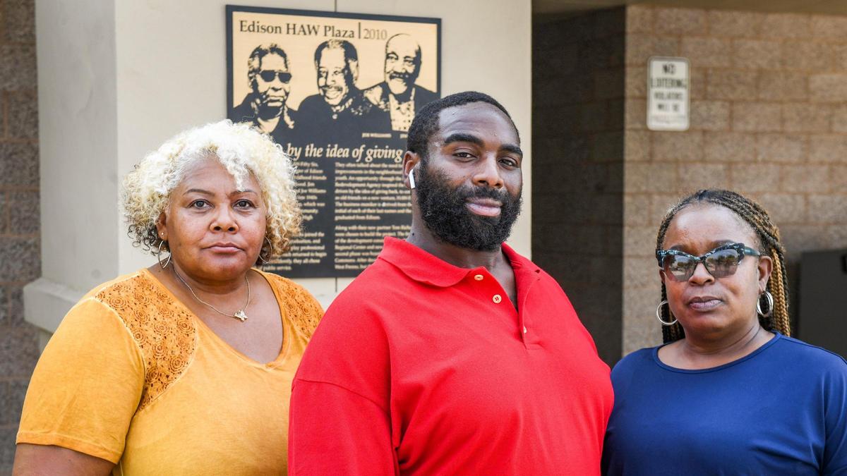 Avis Bragg, from left, James Williams III and Marqui Malone, all of Fresno are photographed outside the office of the Fresno County Department of Social Services at its west Fresno location on California Ave near Edison High School on Tuesday, Sept. 14, 2021.