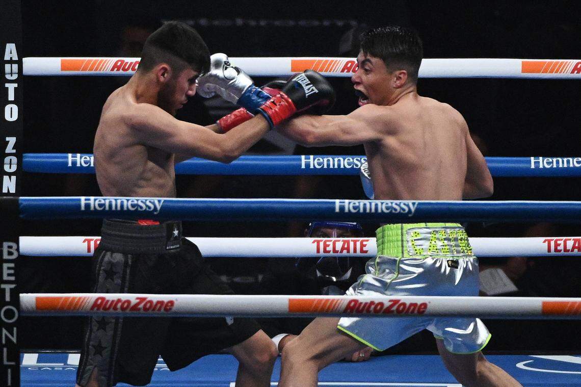 Marc Castro, right, and Luis Javier Valdes during their bout at the Alamodome in San Antonio on Saturday, Dec. 19, 2020.
