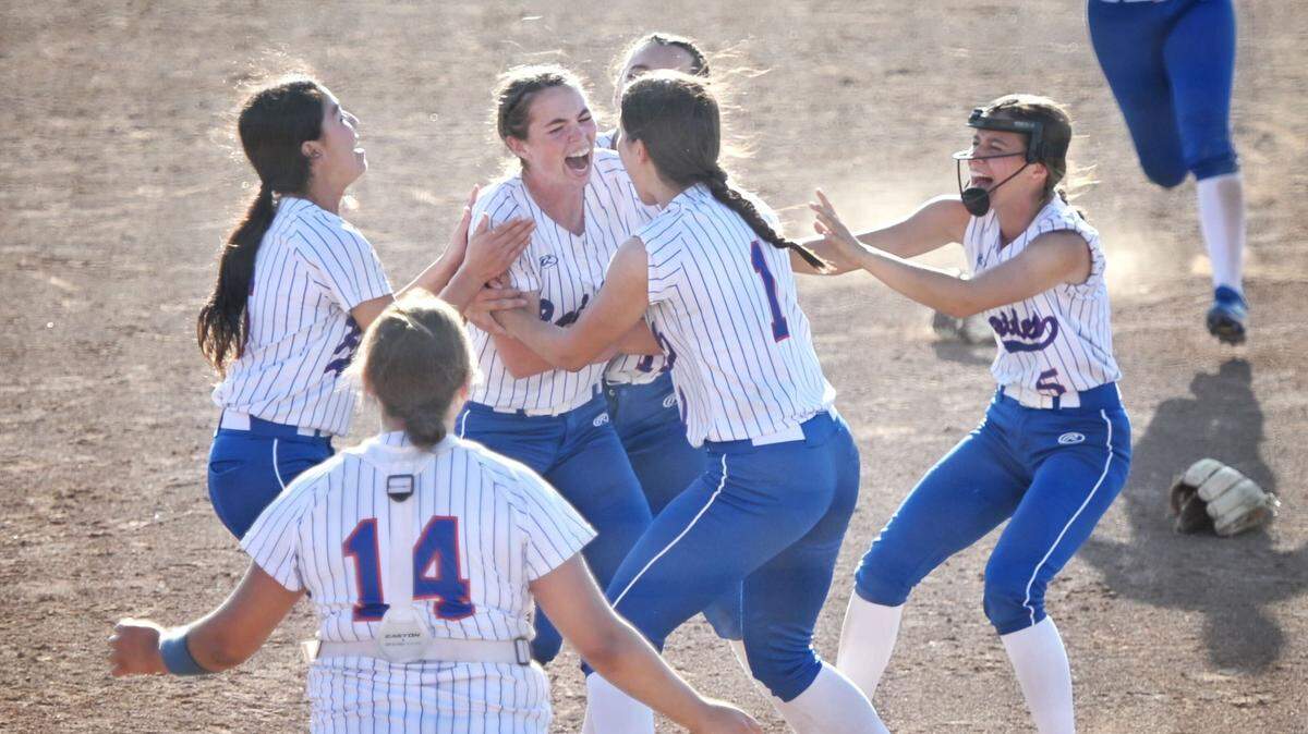Caruthers High players celebrate after defeating Boron for the Central Section Division V softball championship on Saturday, May 28, 2022.