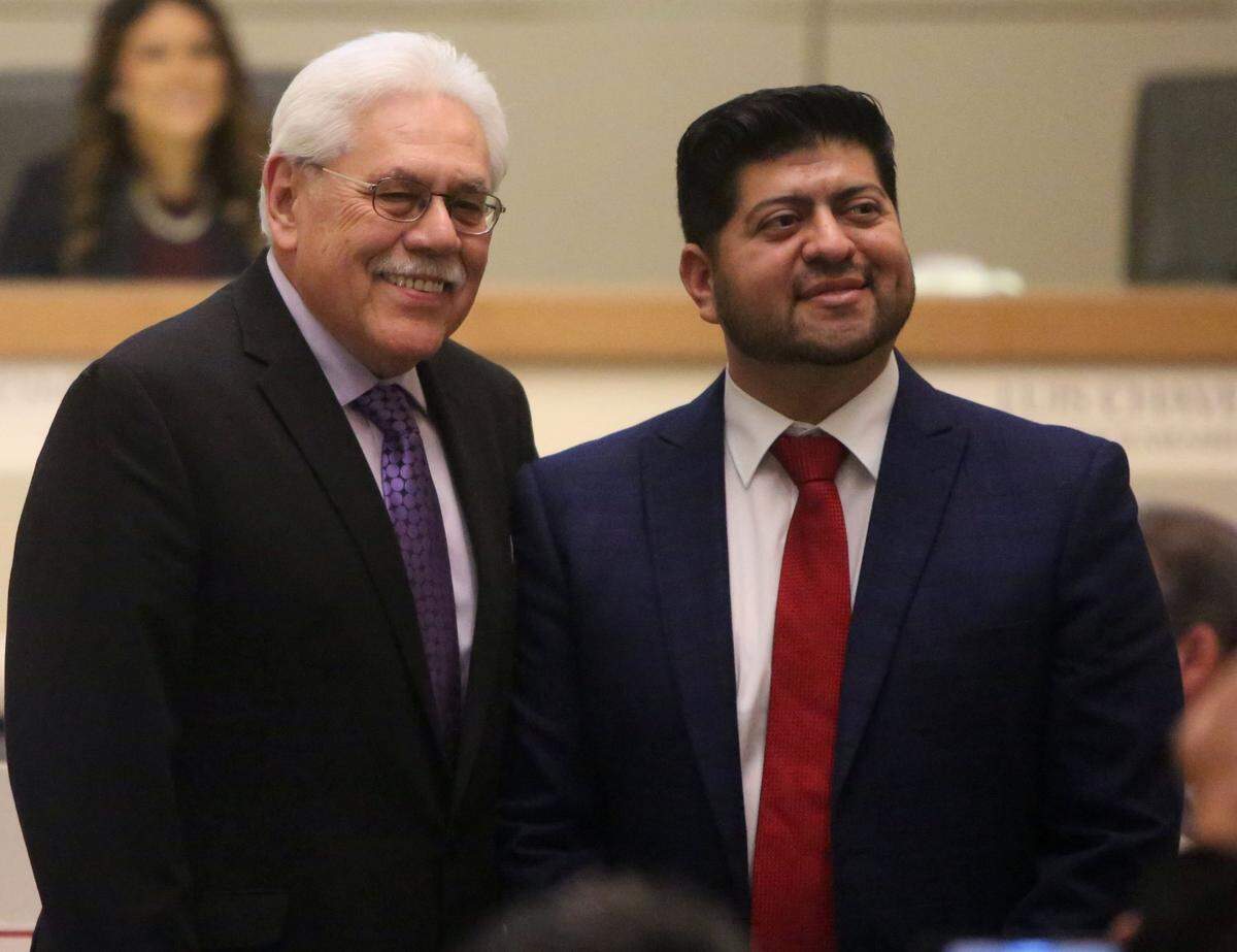 Fresno County Supervisor Sal Quintero, left, swore in his former chief of staff Luis Chavez in a 2019 ceremony to launch Chavez’ second term on the Fresno City Council. Chavez and Quintero will now square off in November for Quintero’s seat representning south Fresno.