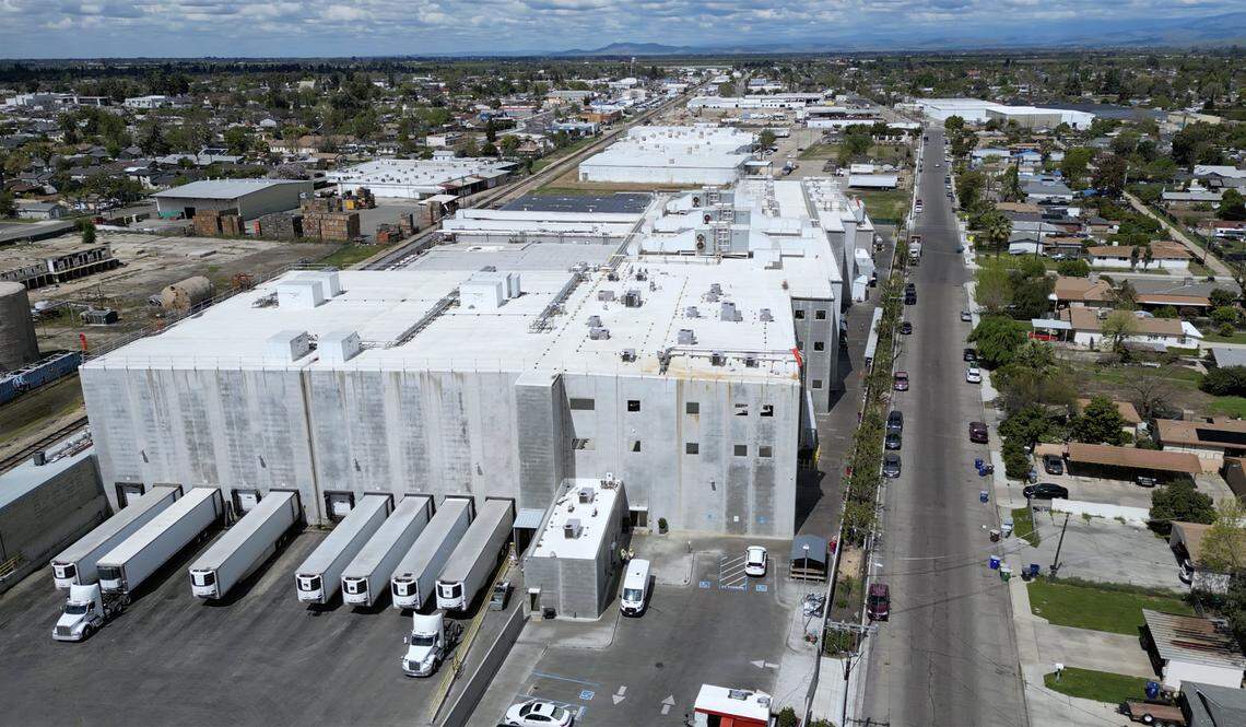 An aerial view of Pitman Farms looking northwards with a neighborhood to the right is seen Thursday, April 3, 3025 at the edge of Sanger. The City of Sanger is now working with Pitman Farms in implementing new standards for water usage and treatment.