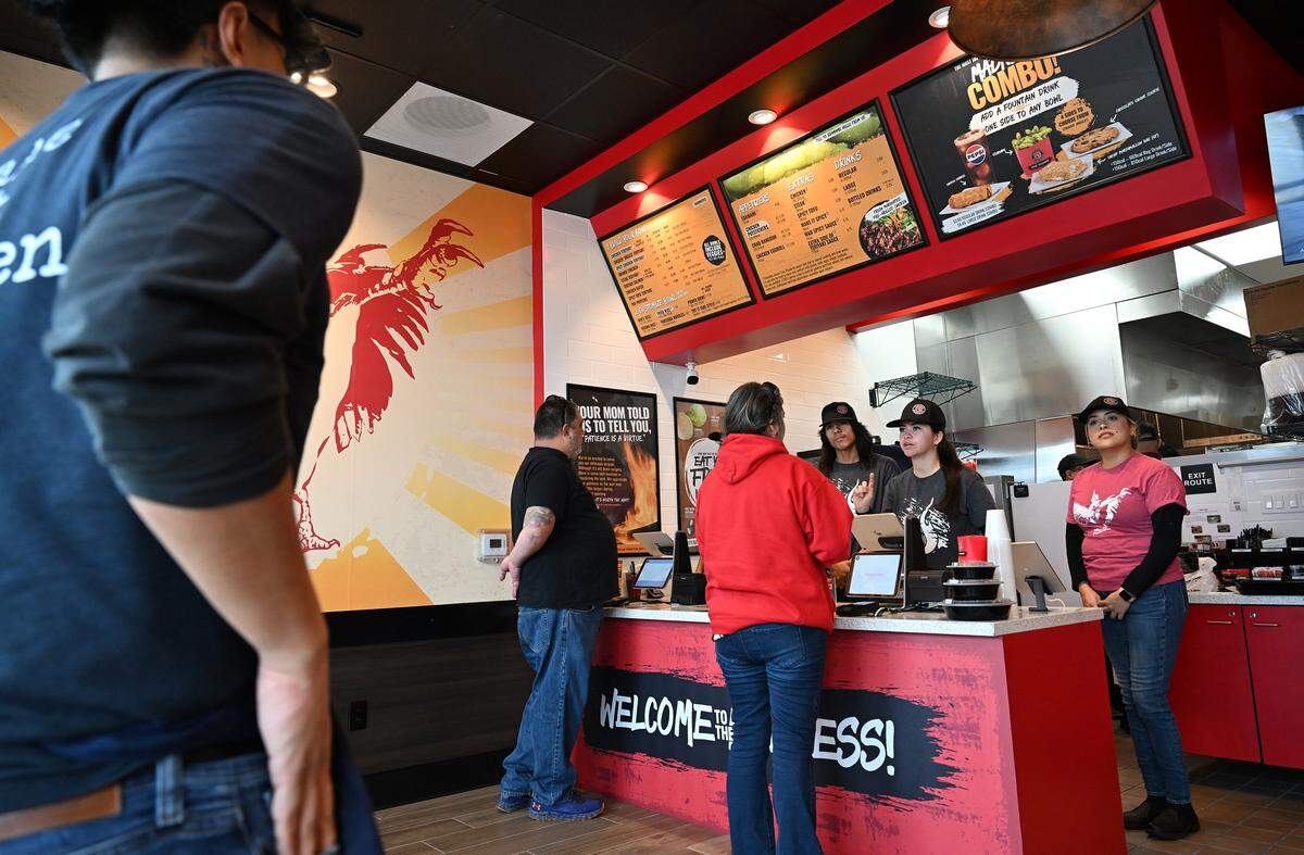 Customers arrive on the sneak peek day for Teriyaki Madness which has opened at The Marketplace at El Paseo. Photographed Wednesday, Dec. 17, 2025 in Fresno.